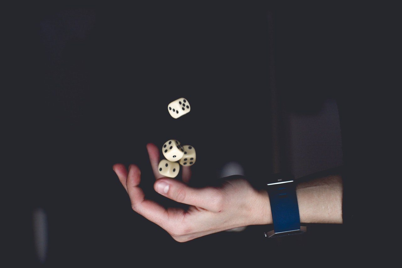 a hand and dices in the dark