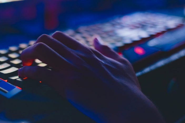 a hand touching a keyboard